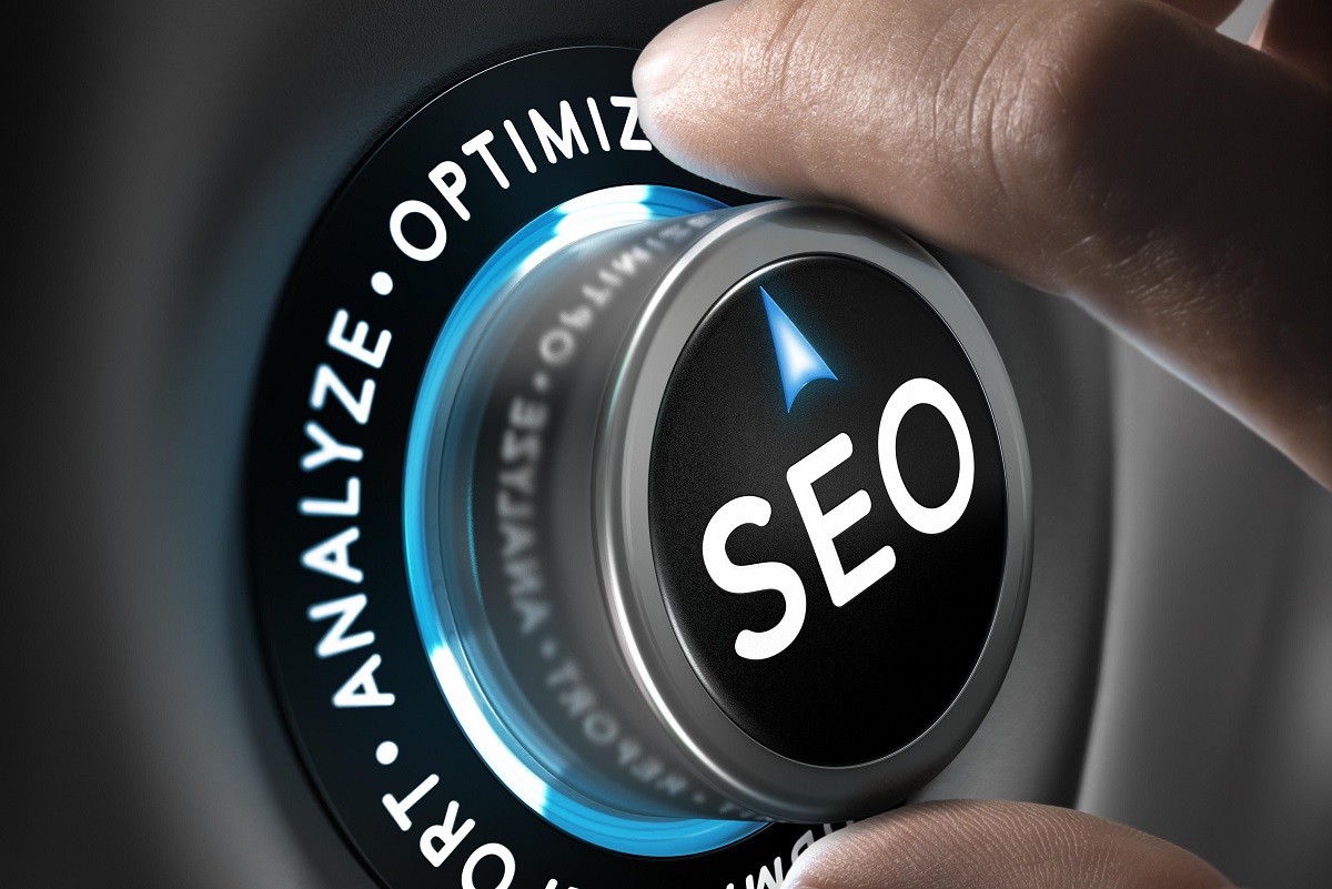Hand turning a dial labeled SEO, emphasizing strategies like analysis, support, and optimization for better search results.